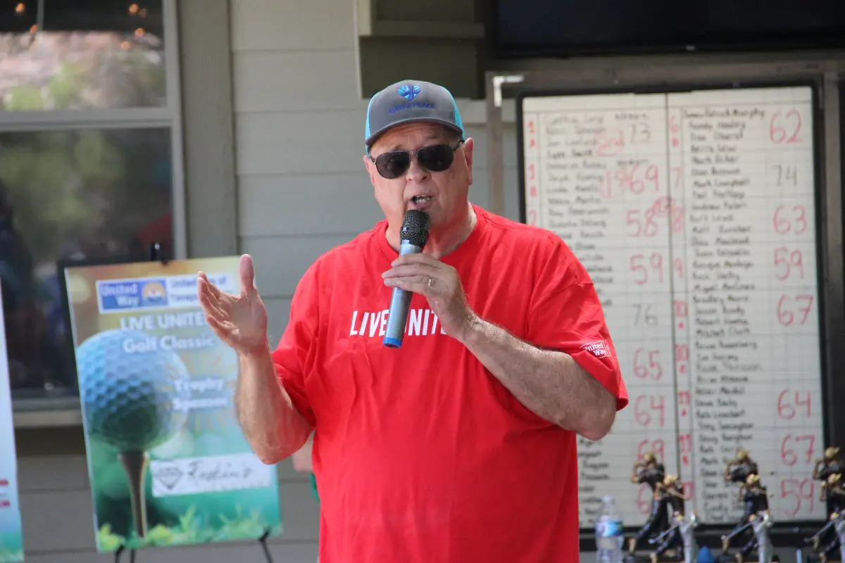 Event sponsor speaks during the Live United Golf Classic awards and recognition program